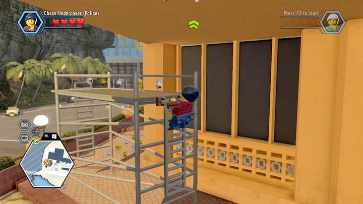 Start climbing over the scaffolding. - Way to the hall | Walkthrough - Chapter 11 - LEGO City: Undercover Game Guide