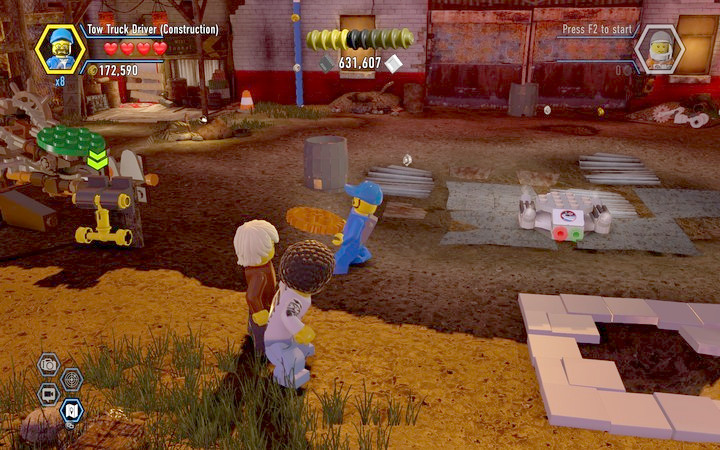 Place the gear in the catapult after you dig the item from the ground - Secrets on the scrapyard | Walkthrough - Chapter 7 - LEGO City: Undercover Game Guide