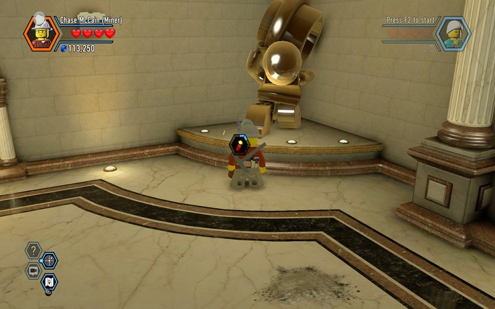 Blow up the statue using the TNT, and you will be able to get behind the second reception - Robbing the gem from the bank | Chapter 6 - Chapter 6 - LEGO City: Undercover Game Guide