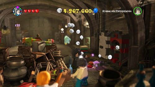 Use a spell to open the white-and-black cabinet on the right of the room - Harry Potter Years 5-7: Tokens - Hogwarts, part 3 - Tokens - LEGO Harry Potter Years 5-7 Guide