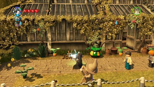 There is a dried plant to the left of the greenhouses entrance - Harry Potter Years 5-7: Tokens - Hogwarts, part 6 - Tokens - LEGO Harry Potter Years 5-7 Guide