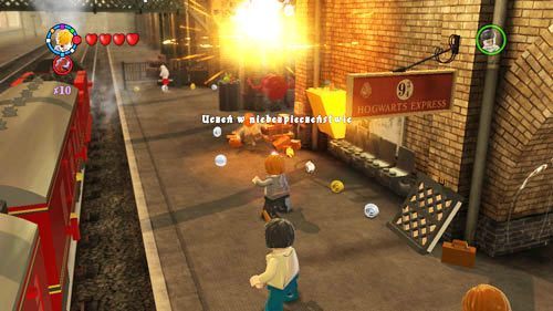 The student is grabbing the clock, shoot at the clock face to save the young wizard - Harry Potter Years 5-7: Students in Peril, part 1 - Other collectibles - LEGO Harry Potter Years 5-7 Guide