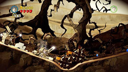 On a hill you will come across some logs blocked by golden brick - Harry Potter Years 5-7: Lovegoods Lunacy, part 1 - Year 7 - LEGO Harry Potter Years 5-7 Guide