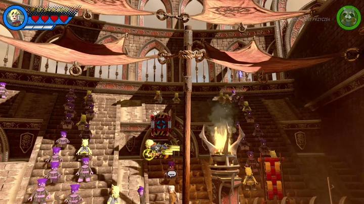 Stan Lee is imprisoned by two thugs on the tribunes, on the left side (in the same place where you found the minikit number 5) - LEGO Marvel 2: Mission 15 - Red King Revelation Secrets - LEGO Marvel 2: Mission secrets - LEGO Marvel Super Heroes 2 Game Guide