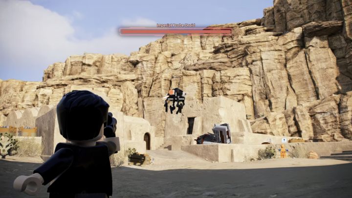 Shoot down the droid attacking the inhabitants and deliver it to the quest giver - LEGO Skywalker Saga: Probes and Cons - walkthrough - LEGO Skywalker Saga: Tatooine - the desert of Jundland - LEGO Skywalker Saga Guide