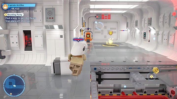 Switch to the second character, avoid the hole in the floor and reach the door with the terminal shown in the picture - LEGO Skywalker Saga: Boarding Party - walkthrough - LEGO Skywalker Saga: Episode 4 - A New Hope - LEGO Skywalker Saga Guide