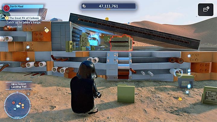 Destroy the bricks under the landing ramp and you will reveal the secret shown in the picture - LEGO Skywalker Saga: Niima Outpost - list of all puzzles - LEGO Skywalker Saga: Jakku - LEGO Skywalker Saga Guide