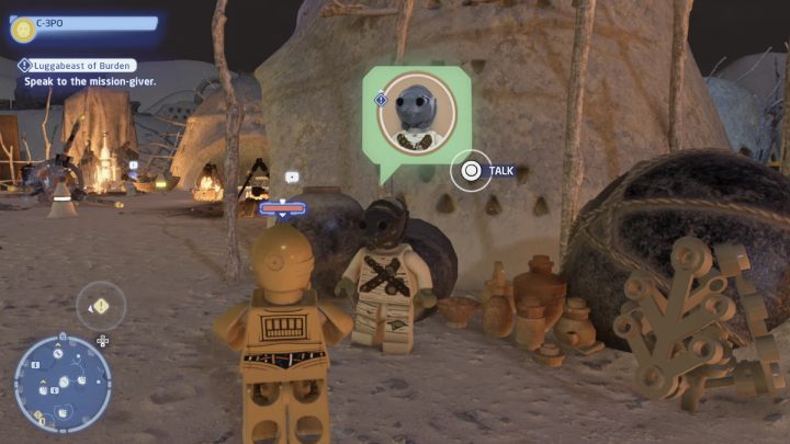 While controlling the protocol droid, talk to the NPC and accept the task - LEGO Skywalker Saga: Luggabeast of Burden - walkthrough - LEGO Skywalker Saga: Jakku - Tuanul Village - LEGO Skywalker Saga Guide