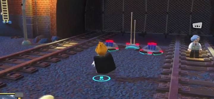 There, at the end of the tracts, there are two switches on the ground next to the tunnel entrance - How to get the gold brick in the container on the water in LEGO The Incredibles? - FAQ - LEGO The Incredibles Game Guide