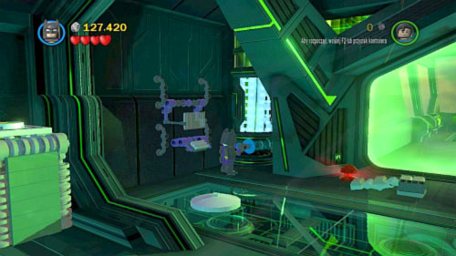 Take it and go to the blue wall on the left (picture) - Destination Metropolis | Walkthrough - Walkthrough - LEGO Batman 2: DC Super Heroes Game Guide & Walkthrough
