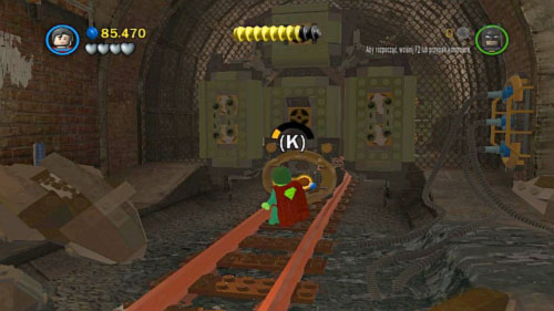 Get down move along tunnel and use Superman to pull the orange handle (picture) and continue march along tunnel - Underground Retreat | Walkthrough - Walkthrough - LEGO Batman 2: DC Super Heroes Game Guide & Walkthrough