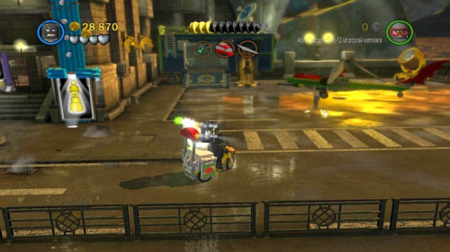 #02 - Destroy searchlight standing on the left corner of the cinema, use brick to build bike - Harboring a Criminal | Minikits - Minikits - LEGO Batman 2: DC Super Heroes Game Guide & Walkthrough