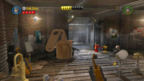 When you get to the basement destroy big gold instrument on the left (picture) where Riddler is hiding - Theatrical Pursuits | Walkthrough - Walkthrough - LEGO Batman 2: DC Super Heroes Game Guide & Walkthrough