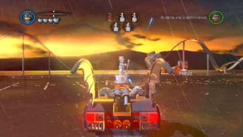 Choose one of the vehicles, get inside, start driving and launch rockets at silver statues (picture) (K key) - Arkham Asylum Antics - prologue | Walkthrough - Walkthrough - LEGO Batman 2: DC Super Heroes Game Guide & Walkthrough