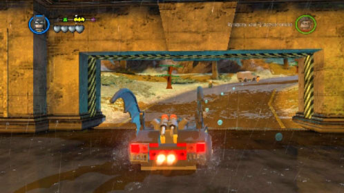 After destroying 5 statues the wide gate will open (picture), pass through it and start driving along the road toward batsign (its marked on the top left corner) - Arkham Asylum Antics - prologue | Walkthrough - Walkthrough - LEGO Batman 2: DC Super Heroes Game Guide & Walkthrough