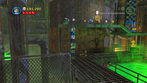 In the next area destroy silver bricks on the right side and use pole to move Robin on the higher floor (picture) - Chemical Crisis | Walkthrough - Walkthrough - LEGO Batman 2: DC Super Heroes Game Guide & Walkthrough