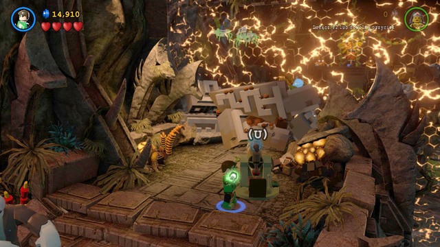 Use the cannon to destroy the blockade, then switch to Grundy, pick up a rock, and throw it at the blockade - Need for Greed - Walkthrough - LEGO Batman 3: Beyond Gotham - Game Guide and Walkthrough