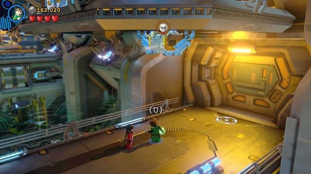 In the room with water containers, go to the right side and use Robins Magnet Suit to access the box - Characters - The Big Grapple - secrets - LEGO Batman 3: Beyond Gotham - Game Guide and Walkthrough