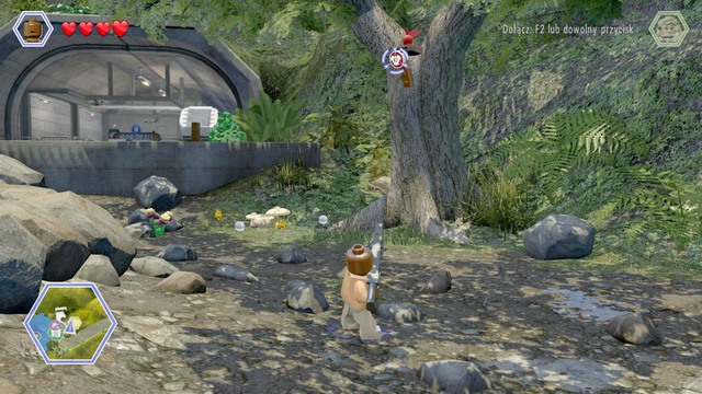 Shoot at the shield shown on the picture and switch your character to velociraptor - Isla Nubar Helipad | Jurassic Park - secrets in free roam - Jurassic Park - secrets in free roam - LEGO Jurassic World Game Guide & Walkthrough
