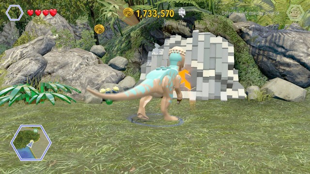 As pachycephalosaurus, destroy the blockade, then switch your character to Timmy and enter the darkened cave - Brachiosaurus Plains | Jurassic Park - secrets in free roam - Jurassic Park - secrets in free roam - LEGO Jurassic World Game Guide & Walkthrough
