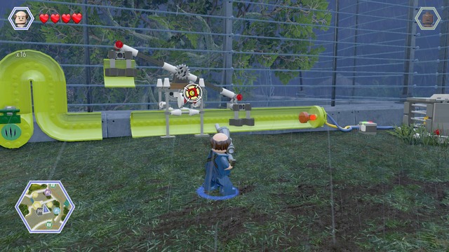 Shoot the shield shown on the picture, change your character to compy and enter the pipe on the left side - Carnivore Territory | Jurassic Park - secrets in free roam - Jurassic Park - secrets in free roam - LEGO Jurassic World Game Guide & Walkthrough