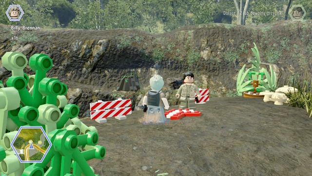 Once you reach the slope, switch your character to dilophosaurus and aim at the black brick on the other side - Shady Grove | Jurassic World - secrets in free roam - Jurassic World - secrets in free roam - LEGO Jurassic World Game Guide & Walkthrough