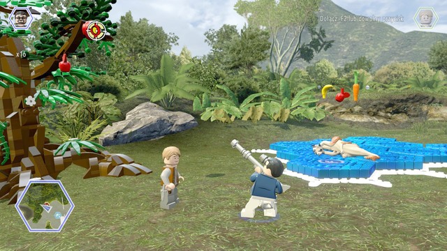 Shoot the shield hanging on the tree with a character that has a weapon - Gyrosphere Valley | Jurassic World - secrets in free roam - Jurassic World - secrets in free roam - LEGO Jurassic World Game Guide & Walkthrough