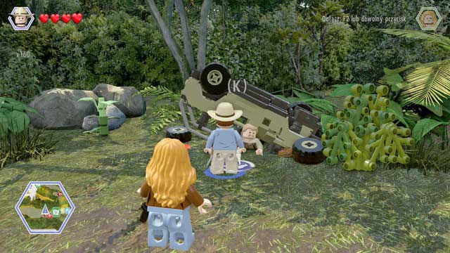 Walk to the trapped worker and pull him from under the car - Long Grass | Jurassic Park - The Lost World - secrets in free roam - Jurassic Park - The Lost World - secrets in free roam - LEGO Jurassic World Game Guide & Walkthrough