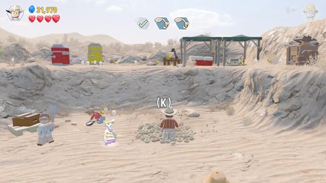 The second of the skeletons, of the three, is on the left - Prologue | Jurassic Park - walkthrough - Jurassic Park - walkthrough - LEGO Jurassic World Game Guide & Walkthrough