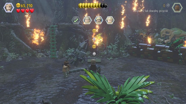 As Owen, climb up and cut through the rope holding the ladder and destroy the plants that hold the car - Under Attack | Jurassic World - walkthrough - Jurassic World - walkthrough - LEGO Jurassic World Game Guide & Walkthrough