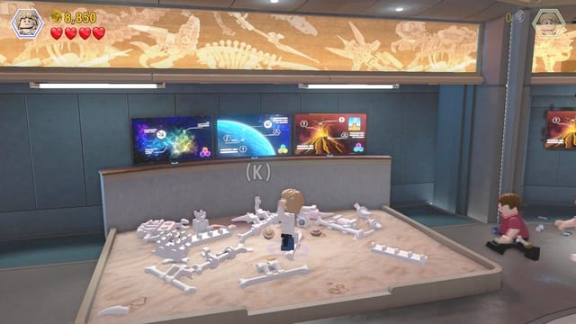After you enter the main hall, approach the wall as Claire and hack into the terminal - Main Street Showdown | Jurassic World - walkthrough - Jurassic World - walkthrough - LEGO Jurassic World Game Guide & Walkthrough