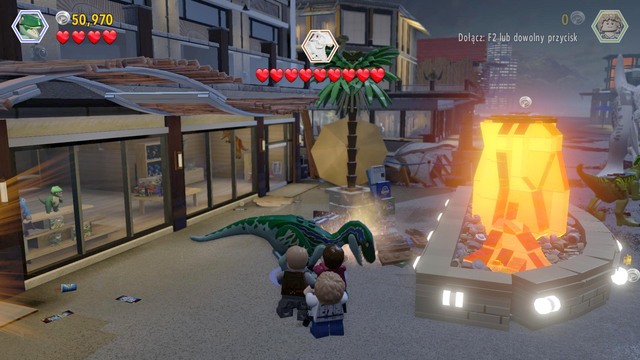 As velociraptor, approach the triceratops figure and follow the scent - Main Street Showdown | Jurassic World - walkthrough - Jurassic World - walkthrough - LEGO Jurassic World Game Guide & Walkthrough