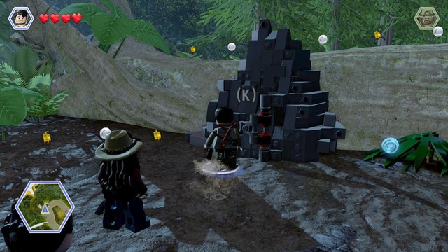 After you follow the turquoise studs to the spot shown in the screenshot, switch to Nick to smash the obstacle, jump over the tree trunk and go towards the camp - The Hunted | Jurassic Park - The Lost World - walkthrough - Jurassic Park - The Lost World - walkthrough - LEGO Jurassic World Game Guide & Walkthrough