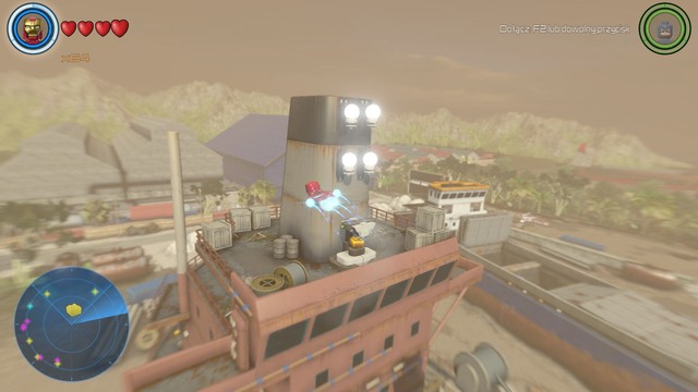 In order to open the container shown on the picture that contains a golden brick you must light up the four lamps above it - Golden bricks - South Africa - secrets - LEGO Marvels Avengers - Game Guide and Walkthrough