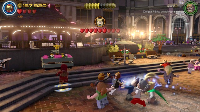 Walk to the left side where you will find the booth shown on the picture - Minikits - Shakespeare in the Park - secrets - LEGO Marvels Avengers - Game Guide and Walkthrough