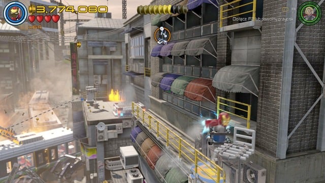 Sixth Minikit will be hanging on the balcony on the building on the right side - Minikits - Korea Prospects - secrets - LEGO Marvels Avengers - Game Guide and Walkthrough