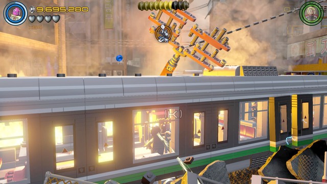 Walk towards the burning train as Vision and destroy all the brick objects that block access to the civilian shown on the picture - Minikits - Korea Prospects - secrets - LEGO Marvels Avengers - Game Guide and Walkthrough