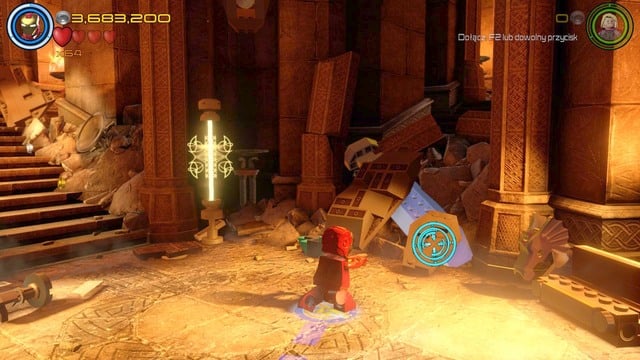 Walk towards the silver sword shown on the picture after walking through the door and destroy the object by using Iron Mans missiles - Minikits - Lost in the Aether - secrets - LEGO Marvels Avengers - Game Guide and Walkthrough