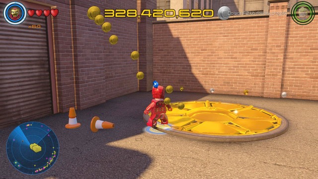 Near the multi-floor parking you will find the golden cover shown on the picture - Golden bricks - Southern Manhattan - secrets - LEGO Marvels Avengers - Game Guide and Walkthrough