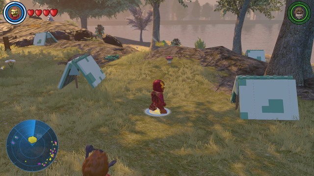Near Avengers base you will find a park with tents in it - Golden bricks - Southern Manhattan - secrets - LEGO Marvels Avengers - Game Guide and Walkthrough