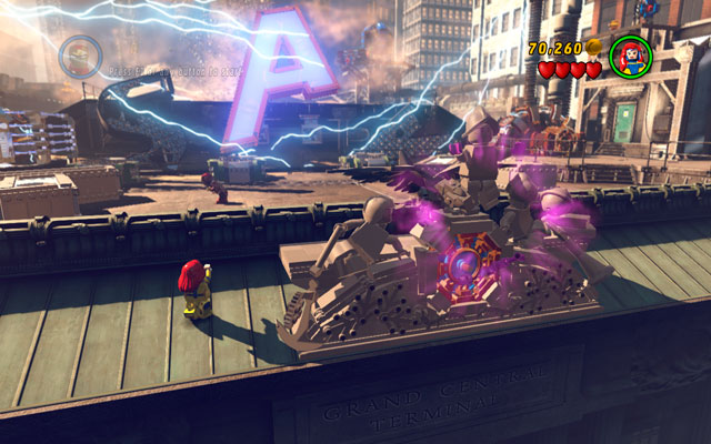 During the first stage of the boss fight turn your character back and approach to the big clock, located on the top of the building - Sand Central Station | Minikit Sets - Minikit Sets - LEGO Marvel Super Heroes Game Guide & Walkthrough