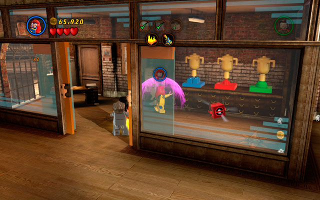 In order to find Deadpool brick, enter the office with Deadpool hidden inside and use Jeans telekinesis power to put nearby chalices in to the right places (the color of basis should be the same as on chalice) - Tabloid Tidy Up | Deadpool Bonus Missions: Collectables - Deadpool Bonus Missions: Collectables - LEGO Marvel Super Heroes Game Guide & Walkthrough
