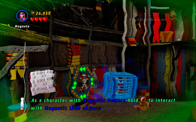 Choose Magneto to decompose the blue metal cage on the left side of the arena, then take the Attract Studs Deadpool Brick to collect coins - Stunt Show Surprise | Deadpool Bonus Missions: Collectables - Deadpool Bonus Missions: Collectables - LEGO Marvel Super Heroes Game Guide & Walkthrough