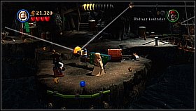 Go to the left and arrange the pile of blown bricks - Smuggler's Den - walkthrough - The Curse of the Black Pearl - LEGO Pirates of the Caribbean: The Video Game - Game Guide and Walkthrough