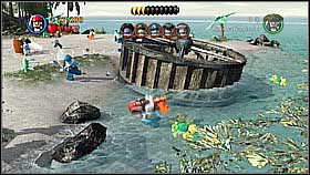 Bottle 7 - In the scene with the big wheel you need to jump to get the bottle - Isla Cruces - bottles - Dead Man's Chest - LEGO Pirates of the Caribbean: The Video Game - Game Guide and Walkthrough