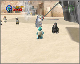 As a Bounty Hunter use the detonator to destroy the shiny metal object shown on the screenshot - Mos Eisley Spaceport - Freeplay Mode - Episode IV - LEGO Star Wars II: The Original Trilogy - Game Guide and Walkthrough