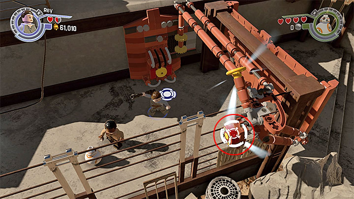 Hitting the button will cause a large explosion, as well as unlock a new passage - Chapter 3 - Niima Outpost | Walkthrough - Story Mode - LEGO Star Wars: The Force Awakens Game Guide