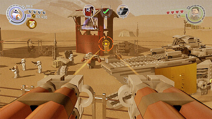 Aim at the gold plated elements of the transport ship and sniper tower. - Chapter 3 - Niima Outpost | Walkthrough - Story Mode - LEGO Star Wars: The Force Awakens Game Guide
