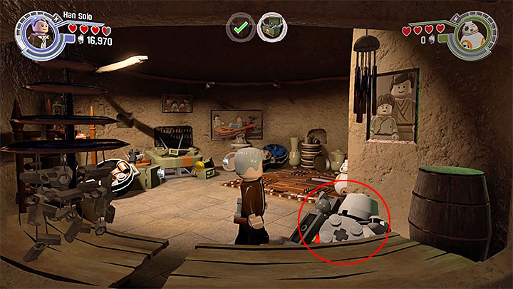 The minikit is at the bottom of the screen inside the building - Chapter 1 - Assault on Jakku | Minikits and red bricks - Minikits and red LEGO bricks - LEGO Star Wars: The Force Awakens Game Guide