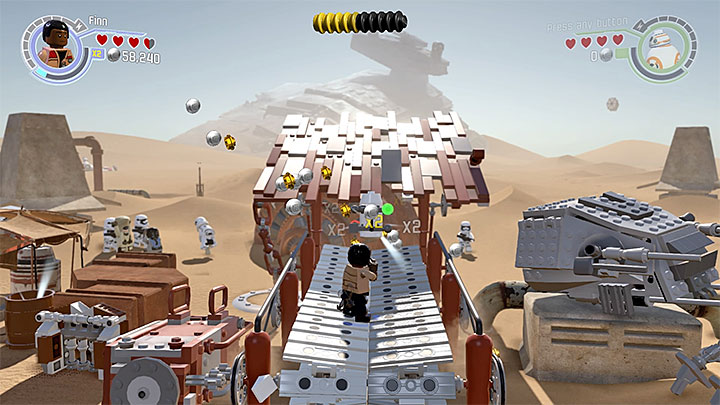 Run along the conveyor until the minikit appears. - Chapter 3 - Niima Outpost | Minikits and red bricks - Minikits and red LEGO bricks - LEGO Star Wars: The Force Awakens Game Guide